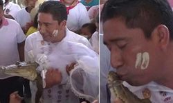 'Bolluk ve bereket' için gelinlik giyen başkan timsahla evlendi